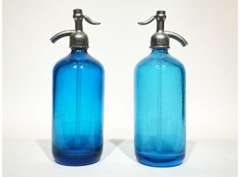 A Pair Of Vintage Blue Glass Seltzer Bottles