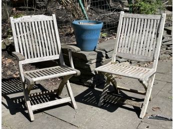 A Pairing Of Weathered Teak Chairs