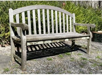 A Weathered Teak Outdoor Bench By Wood Classics