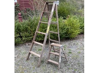 A Pairing Of Wood A-Frame Ladders