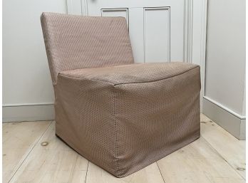A Slip Covered Chair By West Elm