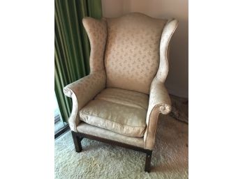 Wing Chair With Sage Green Flowers And A Gold/beige Tone Background
