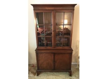 One Piece Hutch With Glass Doors On Top And Two Solid Doors On Base
