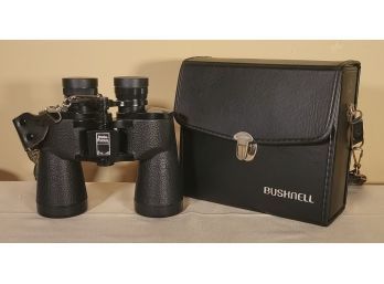 Bushnell Insta-Focus Binoculars.             -             -              -         Loc: Abov E Microwave.