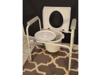 Invacare Bedside Commode.          Great Shape.  Don't Buy New .               Loc: Family Room