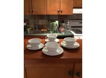 Set Of Four White Tea Cups With Saucers