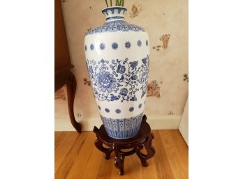 Tall Asian Vase On Stand With Flowers.