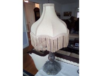 Table Top  Victorian Style Metal Lamp With Silky Shade That Has Brocade And Tassles