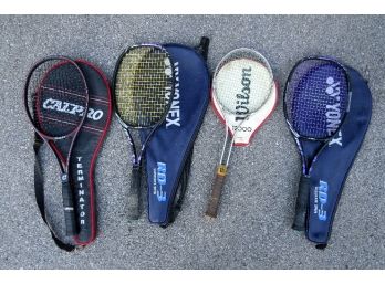 A Grouping Of 4 Tennis Racquets With Cases