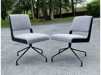 Sleek Modern Steel Framed Swivel Chairs By CB2