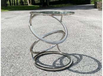 A Chrome And Glass Cocktail Table