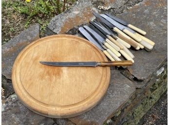 A Cutting Board And Vintage Bakelite Handled Knives