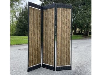 A Metal Dividing Screen With Fabric Panels