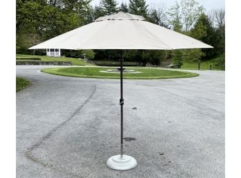 A Tropishade Umbrella And Tucci Stainless Steel Base