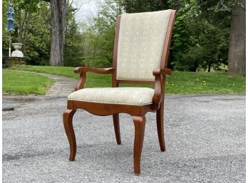 A Cherry Wood Arm Chair By Ethan Allen