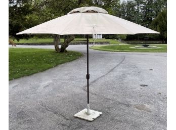 A Tropishade Umbrella And Steel Base