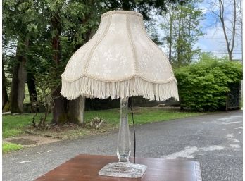 A Vintage Etched Glass Lamp With Silk And Fringe Shade