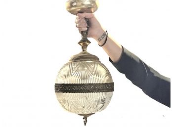 A Glass And Brass Orb Light Fixture