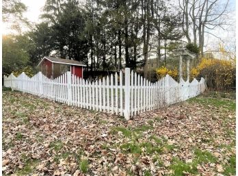 A Wooden White Picket Garden Fence