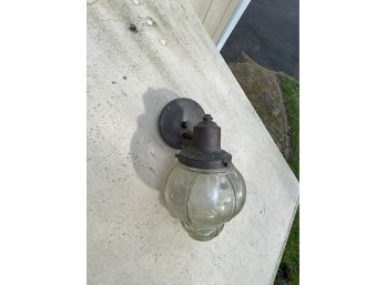 A Vintage Copper And Rounded Glass Globe Exterior Sconce