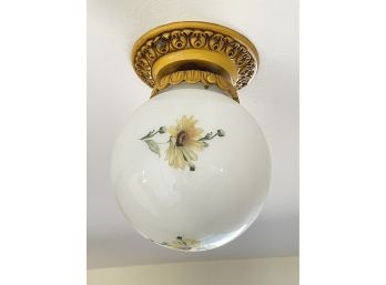 A Decorative Light With Painted Flowers On Globe