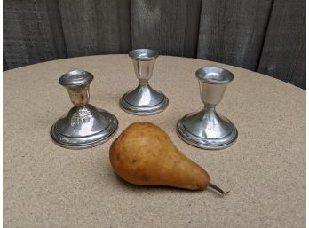 A Grouping Of 3 Weighted Sterling Silver Candle Holders