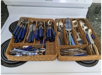 Grouping Of Two Baskets Full Of Flatware