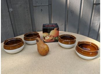 Grouping Of Four French Onion Soup Bows And A Terracotta Garlic Roaster