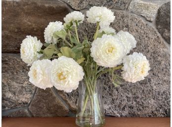 A Beautiful Faux Bouquet Of Flowers In A Clear Vase