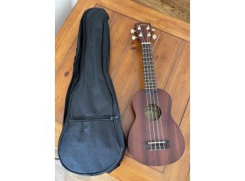 A Makala Ukulele With Case