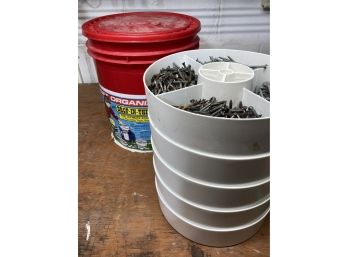 Container With Stackable Trays Full Of Nails And Screws