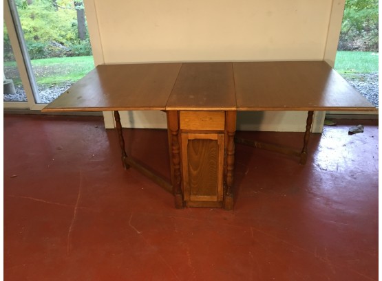 Drop Leaf Single Drawer Table With Swing Out Legs. (Click On Photograph For Full Description And Additional Photos)