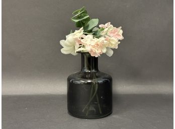Pretty Faux Floral In A Dark Green Glass Vase