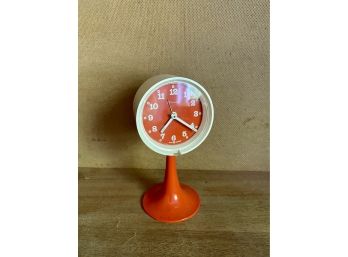 An Adorable Orange Mid Century Bedside Alarm Clock