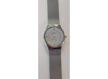 Ladies Skagen Silver Tone Watch With Gold Tone Markers And Hands