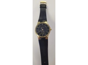 Ladies Skagen Gold Tone Watch W/black Face And Black Band