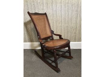 Vintage Cane Backed Carved Hardwood Rocker