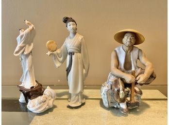 Group Of Three Asian Themed Figurines Including A Mud Man