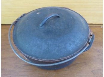 A Cast Iron Dutch Oven With Lid
