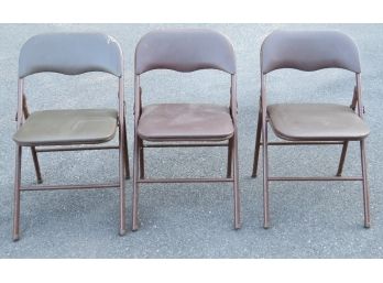 A Trio Of Brown Metal Folding Chairs W/cushioned Seats