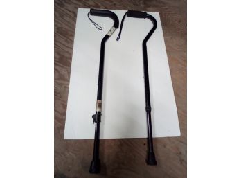 Two Metal Walking Canes - One With Cushion Grip - Both Rubber Base In Good Condtion - Adjustable Height  E5