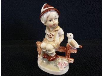 Antique Porcelain Boy Sitting On Fence With The Bird Figurine
