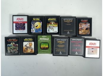 A LOT OF ELEVEN ATARI GAMES, INCLUDES PAC-MAN, STREET RACER, PIT-FALL, SPACE INVADERS, CENTIPEDE, ETC.