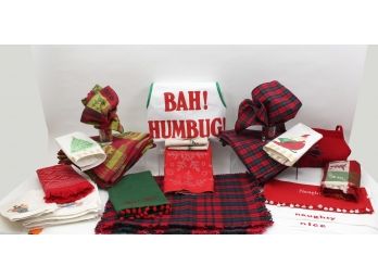 An Assortment Of Christmas Napkins, Placemats, Apron And More