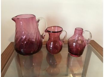 3 Pc. Cranberry Glass Pitchers With Applied Clear Handles