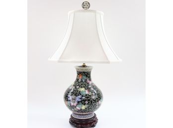Chinese Hand Painted Porcelain Enamel Glaze Bottle-Shaped Lamp With A Floral And Butterfly Design On A Wooden Base