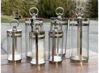 A Set Of Stainless Steel Lanterns From Pottery Barn