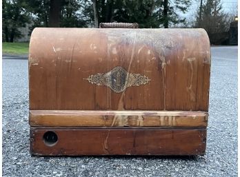 An Antique Sewing Machine In Box