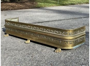 An Antique Pierced Brass Fireplace Fender