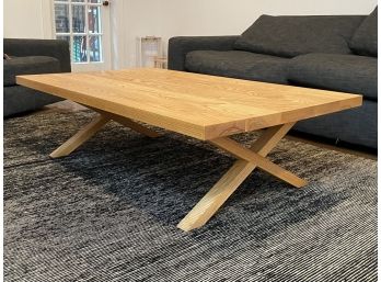 A Modern Oak 'X' Base Coffee Table By West Elm